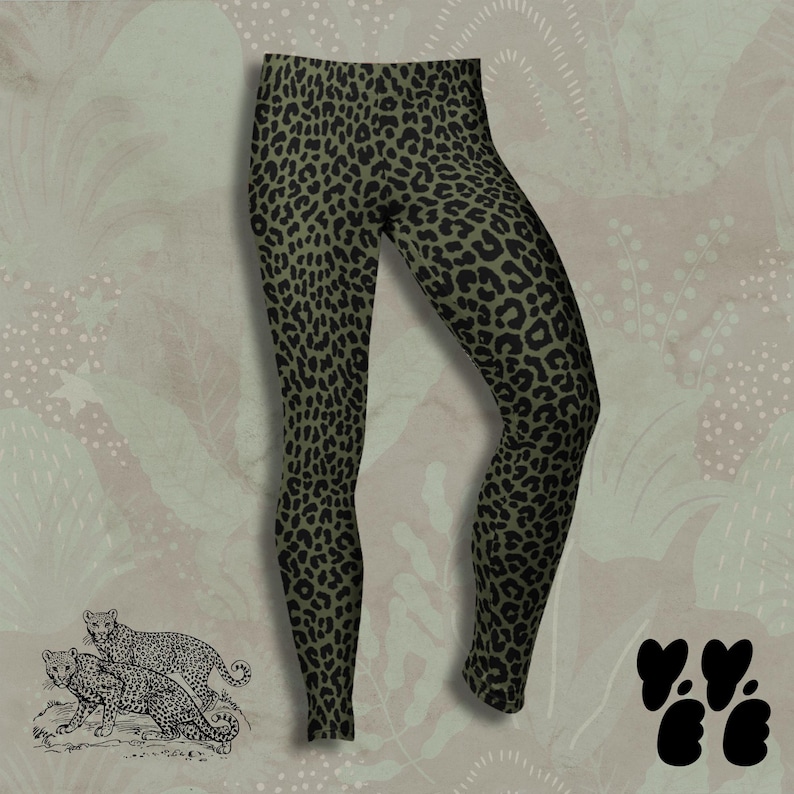 May include: Full-length leggings featuring an olive green base color with a repeating black leopard print pattern. The garment has a high-waisted design and a fitted silhouette that extends down to the ankles, showcasing a consistent animal print.