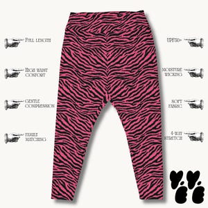 May include: Full-length leggings featuring a vibrant pink and black zebra stripe pattern. The text labels indicate features including UPF50+, moisture wicking, high waist comfort, gentle compression, soft fabric, 4-way stretch, and family matching.