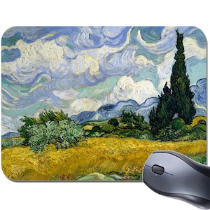 May include: A mouse mat featuring a painting of a field of wheat with a tall cypress tree in the background. The sky is a swirling blue and white with thick brushstrokes.