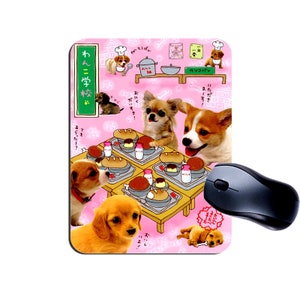 May include: A pink mouse mat with a cartoon illustration of dogs eating at a table. The text on the mouse mat says "Wanko Gakko" which translates to "Dog School".