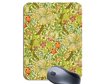 May include: A green and cream mouse pad with a floral pattern featuring lilies, leaves, and small red and orange flowers. The mouse pad is designed with a repeating pattern.