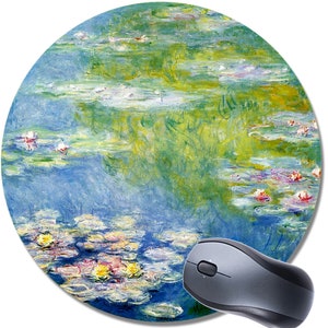 May include: A round mouse pad featuring a painting of water lilies in shades of blue, green, and white. The painting is reminiscent of Impressionist art.