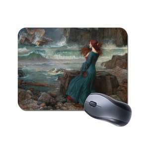 May include: A woman in a blue dress stands on a rocky shore, looking out at a stormy sea. The waves are crashing against the rocks, and a ship is in the distance.