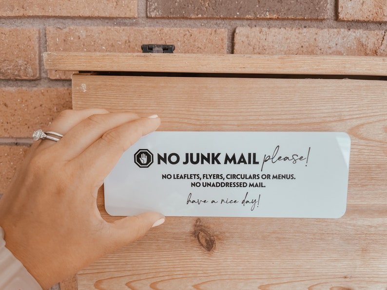 May include: White sticker with black text that reads "✔ NO JUNK MAIL please! NO LEAFLETS, FLYERS, CIRCULARS OR MENUS. NO UNADDRESSED MAIL. have a nice day!"