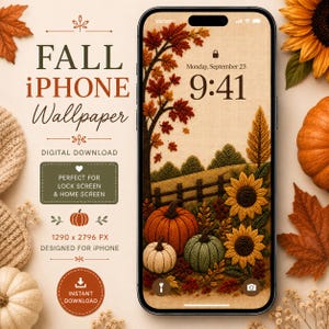 May include: A smartphone displaying a digital wallpaper with a textured, embroidered-style autumn scene featuring sunflowers, pumpkins, and fall foliage. The screen shows the time 9:41 and the date Monday, September 23, against a beige background.