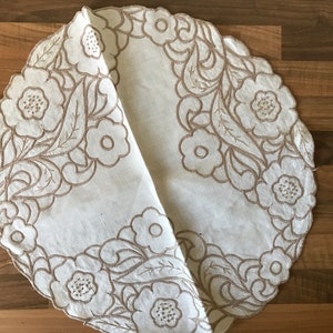 Pair of vintage, cut work embroidered, table mats. One unusual shape. See photos for measurements.