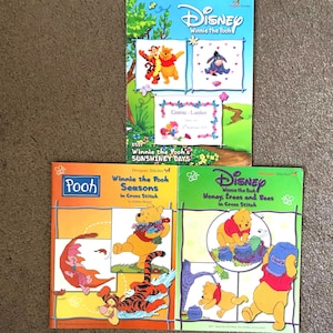 Winnie the Pooh cross stitch booklets by Designer stitches. Three to choose from Sunshiny days, Seasons and Honey, trees and bees.