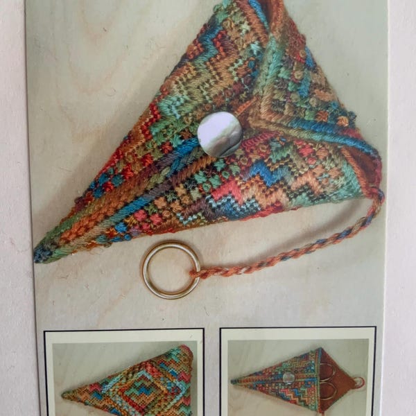 New and unopened cavas work ‘ scissor poke ‘ kit by Sue Hawkins is stitched in bright and colourful wools.  Measures 9cms long closed.
