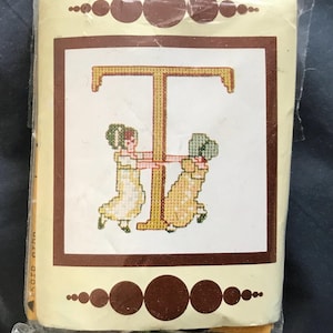 Kate Greenaway mini alphabet cross stitch kits,(linen) by Lanarte. A choice of various capital letters of the alphabet in blue and pink.