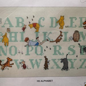 Cross stitch kit - Winnie the Pooh alphabet. Rare find. In perfect condition. 26 cm x 47 cm in size. 18 count