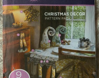 Christmas sewing Pattern and instructions for a variety of festive decorations . Quick and easy designs by Threaders.