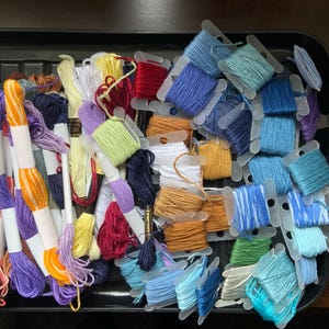 Embroidery threads, large bundle of embroidery threads, mixed makes. Some skeins and some on bobbins. No codes ,
