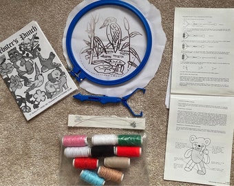 Punch needle kit bundle with book of transfers, threads hoop and different size needles.