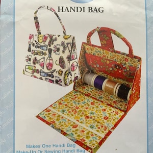 A vintage covered box/bag making kit. A ‘Handibag’ by Pinflair. Contains die cut card, magnet and handle. Extra materials required