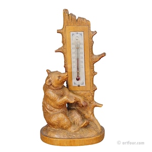 A Wooden Carved Black Forest Thermometer with Bear