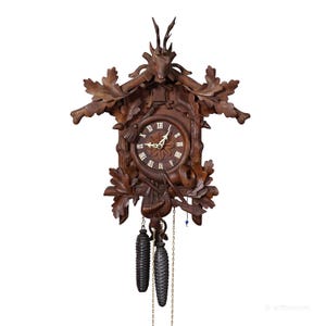 Antique Black Forest Carved Cuckoo Clock with Stag Head on Top