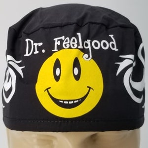 May include: Black scrub hat with a white smiley face and the text "Dr. Feelgood" in white.