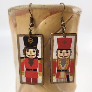Earrings. Nutcracker Christmas earrings in red are handmade with decoupaged wood.