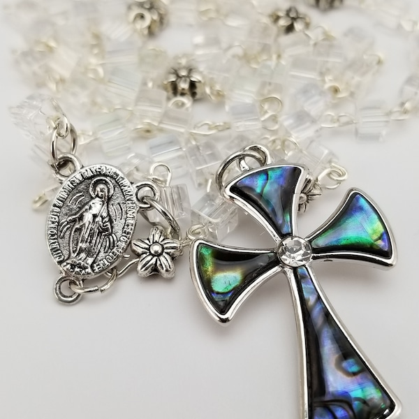 Rosary. Crystal clear cube beads and dainty flower extras make this nice rosary with abalone shell studded cross.