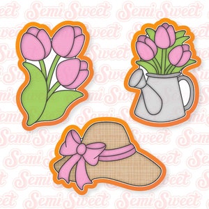 May include: Three spring-themed cookie cutters: tulips, tulips in a watering can, and a sun hat with a pink bow. The cutters have an orange outline and are designed for baking. The image has a repeating "Semi Sweet" watermark.