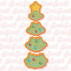 May include: Four layered cookie cutters in the shape of a Christmas tree. The cutters are orange with green and red details. The top layer has a star, the second layer has ornaments, the third layer has ornaments and lights, and the bottom layer has ornaments and lights.