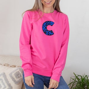 Women&#39;s Embroidered Personalised Animal Print Initial Pink Sweatshirt