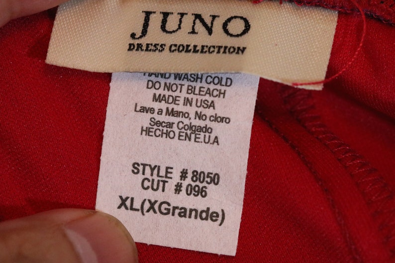May include: White tag with black text that reads "JUNO DRESS COLLECTION" and care instructions in English and Spanish. The tag also includes style and cut numbers, and the size XL(XGrande).