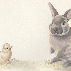 May include: A watercolour painting of a grey rabbit sitting on a grassy surface, looking to the left. A small, light brown chick sits on the grass to the left of the rabbit.
