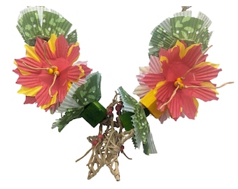 May include: A colorful bird toy featuring paper flowers in red, yellow, and pink, accented with green and white patterned paper. The toy includes wooden blocks and a woven star base, designed for avian enrichment.