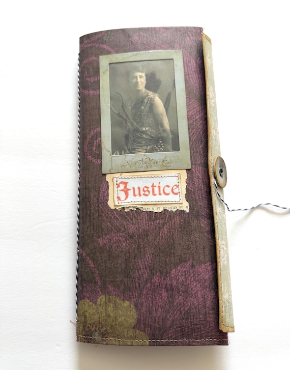 A genuinely handmade trifold junk journal built around suffrage-era women's portraits — layers of antique ephemera, aged papers, and feminist history stitched into a one-of-a-kind keepsake diary.