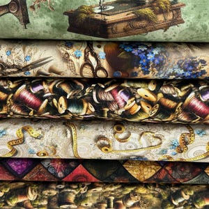 May include: A collection of fabric rolls featuring sewing-related designs. Patterns include vintage sewing machines, scissors, thread spools, and measuring tapes. The colour palette includes green, beige, purple, and brown, giving a vintage feel.