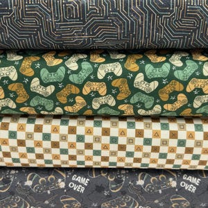 May include: A white ceramic mug with a black handle and the text "But First, Coffee" in a bold, black font. The mug is set against a blurred background, suggesting a cozy setting.