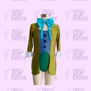 May include: A green, blue, and gold leotard with a long, olive green jacket. The jacket has a blue vest with buttons and a blue bow tie. The leotard has a green skirt and a white ruffle on the sleeves.