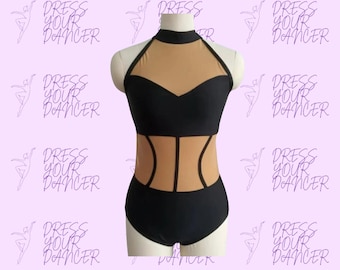 May include: A black leotard featuring a high neckline and a sleeveless design. The garment includes beige mesh panels at the chest and waist, creating a cutout effect. The bodice is constructed with solid black fabric panels and a high-neck collar.