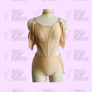 May include: A beige leotard featuring a choker-style neckline, sheer mesh panels on the bodice, and ruffled cold-shoulder sleeves. The garment includes structured vertical seams across the torso and cut-out details at the waist, displayed on a mannequin.