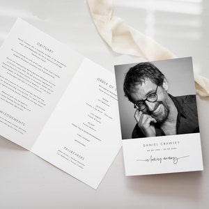 May include: A black and white funeral order of service with a photograph of a smiling man. The order of service includes a welcome and introduction, prayers, selections, tributes, eulogy, final viewing, and acknowledgements. The text "In loving memory" is written in cursive at the bottom of the order of service.