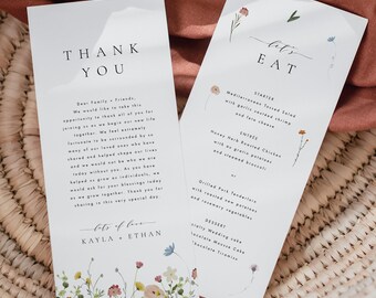 Op de afbeelding: Twee witte kaarten met bloemillustraties en tekst. De eerste kaart zegt "Bedankt" en bevat een boodschap van dankbaarheid. De tweede kaart zegt "Laten we eten" en somt een huwelijksmenu op met voorgerecht, hoofdgerecht en dessert.