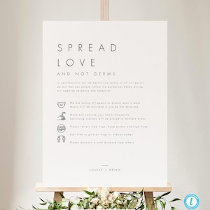 May include: A white sign with black text that reads "Spread Love and Not Germs". The sign includes a list of guidelines for guests to follow at a wedding, including wearing masks, sanitizing hands, and refraining from hugs and handshakes. The sign is on an easel and the names "Louise + Brian" are at the bottom.