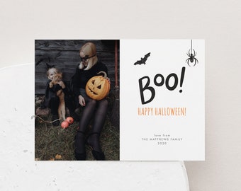May include: A Halloween card with a photo of a mother and child in costumes. The card says "Boo! Happy Halloween!" and "Love from The Matthews Family 2020".