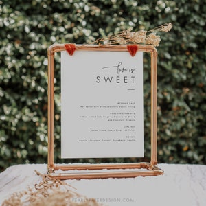 Puede incluir: Un cartel blanco con el texto "Love is Sweet" en un soporte de tuber&iacute;a de cobre. El cartel enumera pastel de bodas, tiramis&uacute; de chocolate, cupcakes y donas.