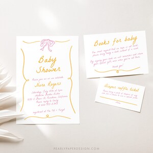 May include: A pink and gold baby shower invitation with a pink bow. The invitation includes the text "Baby Shower" and the name "Nora Rogers". The invitation also includes the date, time, and location of the shower. There are two additional cards, one for a book request and one for a diaper raffle.