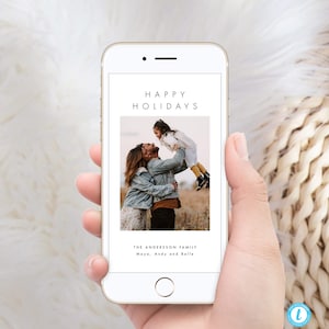 May include: A digital holiday card with a photo of a family of three. The text "Happy Holidays" is at the top of the card, and the text "The Andersson Family Moya, Andy and Belle" is at the bottom.