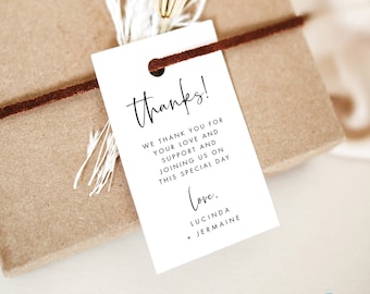 May include: White wedding favor tag with black text that reads "thanks! We thank you for your love and support and joining us on this special day. Love, Lucinda + Jermaine".