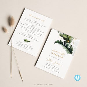 May include: A white invitation with gold lettering for a bachelorette weekend. The invitation features a tropical theme with green and gold foliage. The text reads "Bachelorette Weekend" and "Join us to celebrate the bride-to-be,  Ebner Jensen". The invitation also includes the date, location, and contact information for the bride.