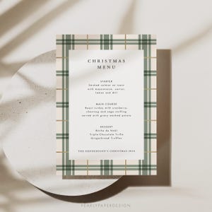 May include: A Christmas menu with a green and white plaid background. The menu includes a starter, main course, and dessert. The text reads "Christmas Menu", "Starter", "Smoked salmon on toast with mayonnaise, caviar, lemon and dill", "Main Course", "Roast turkey with cranberry, chestnut and sage stuffing served with gravy mashed potato", "Dessert", "B&uuml;che de No&euml;l", "Triple-Chocolate Trifle", "Gingerbread Truffles", and "The Henderson's Christmas 2024".