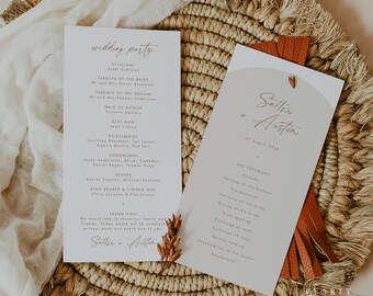 May include: Two wedding program cards with elegant calligraphy. One card lists the wedding party, including the officiant, parents, and bridesmaids. The other card details the ceremony, with the couple's names and date. The cards are on a woven mat.