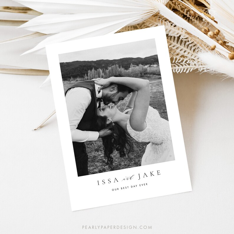 May include: Black and white wedding photo of a couple kissing. The text "ISSA and JAKE OUR BEST DAY EVER" is below the photo.