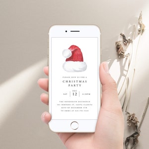 May include: A smartphone screen displaying a Christmas party invitation with a red and white Santa hat illustration. The invitation reads "Please join us for a Christmas Party, Sat Dec 12, 6:30pm, The Henderson Residence, 101 Berners St, Santa Clarita, RSVP by December 5th to Emma at 626-785-5345."