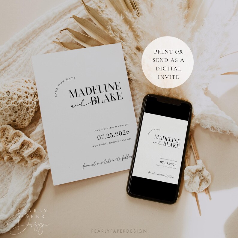 May include: A save the date card with a minimalist design featuring the names Madeline and Blake, the date 07.25.2026, and the location Newport, Rhode Island. The card is printed on white paper with black text. The card is displayed next to a smartphone with a similar design.