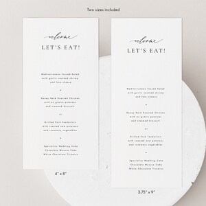 May include: Two printable wedding reception menu cards with a minimalist design. The cards are white with black text and feature the phrase "Welcome, Let's Eat!" at the top. The menu includes Mediterranean Tossed Salad, Honey Herb Roasted Chicken, Grilled Pork Tenderloin, and a selection of wedding cakes. The cards are available in two sizes: 4 inches by 8 inches and 3.75 inches by 9 inches.
